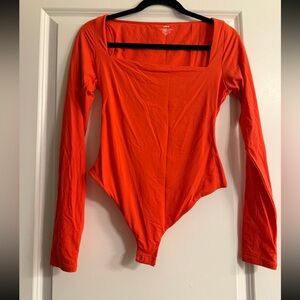 Skims long sleeve bodysuit orange